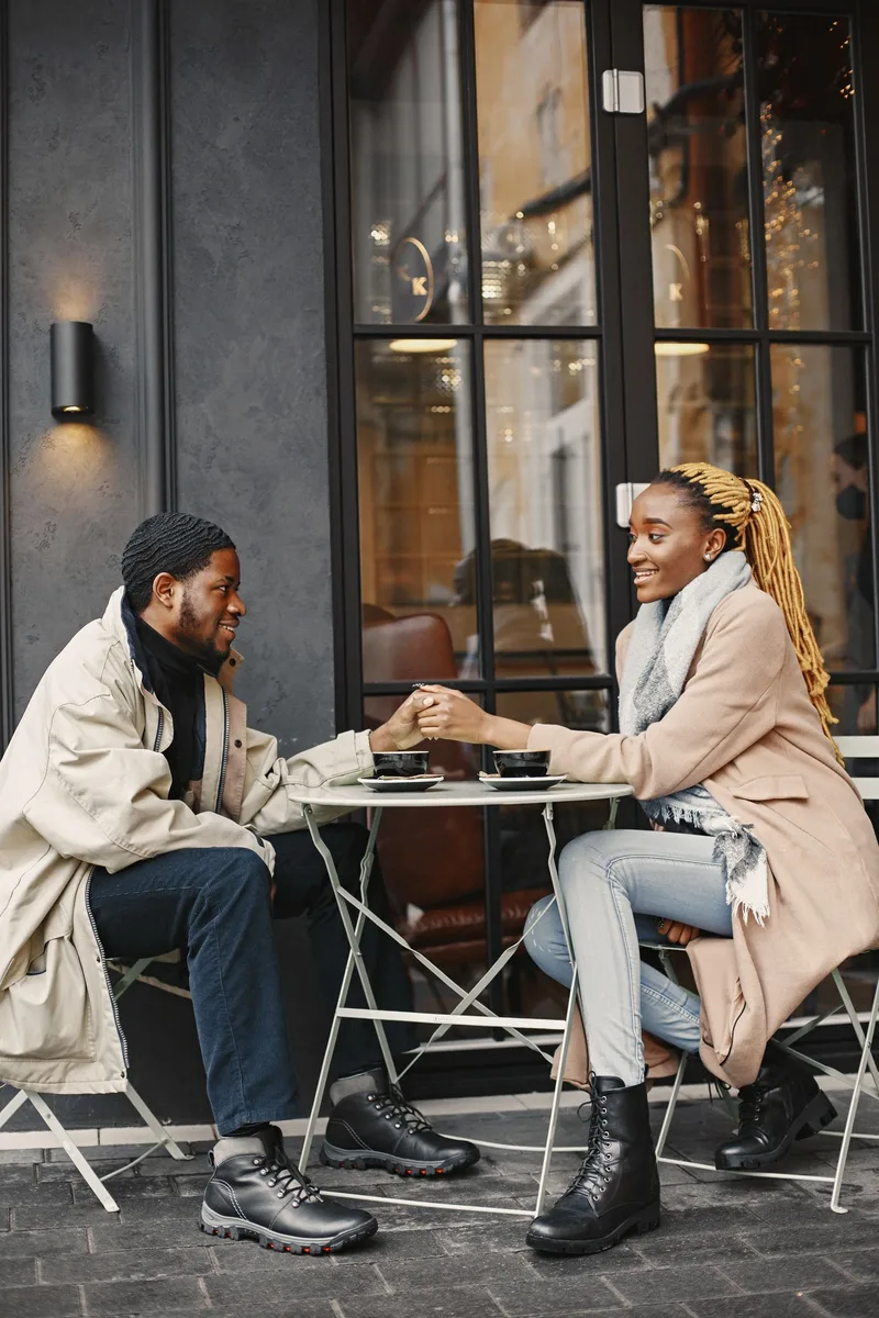 A couple sharing a warm conversation over coffee